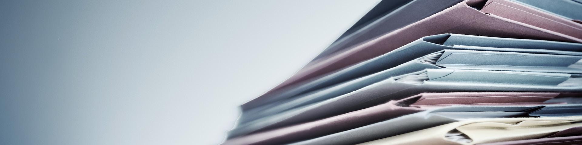 Stack of multi coloured file folders