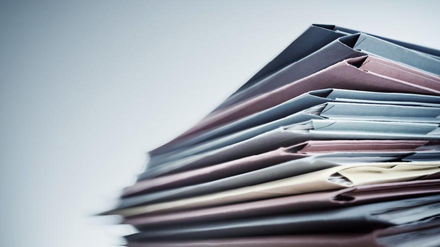 Stack of multi coloured file folders